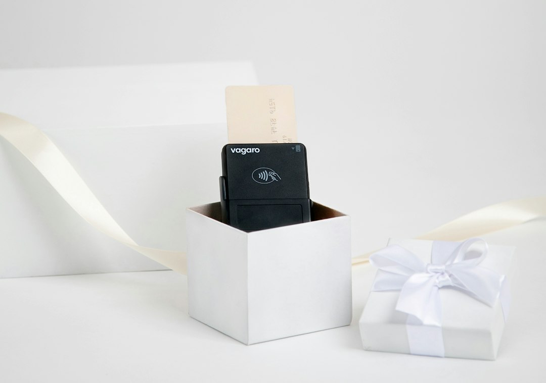 A card reader inside a gift box, showing how to buy and sell gift cards online at reloadly.shop